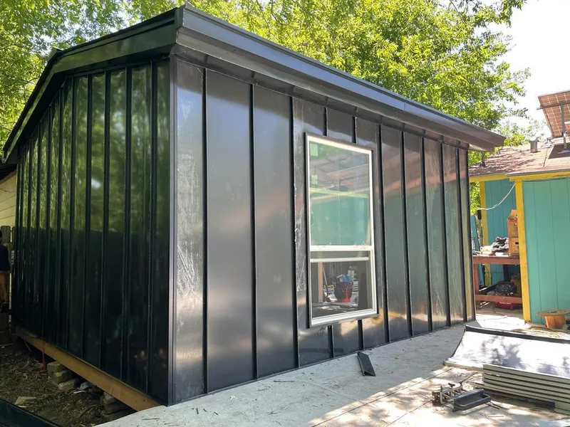 Black standing seam metal wall panels for Roof Inspection in Middleton